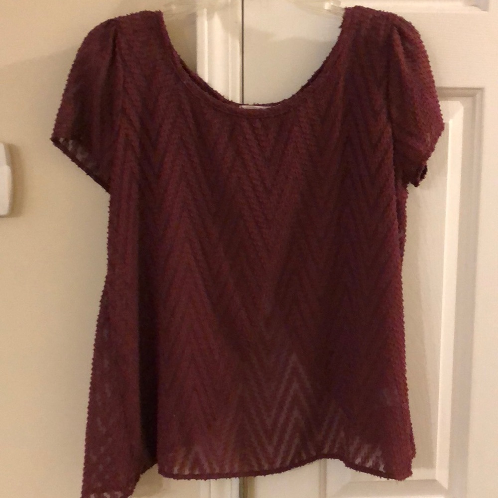 Dark red top. Sheer with chevron details! Open back! Really cute with black tank